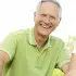 grey haired guy with a green shirt being happy